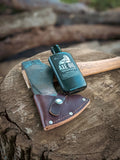 axe oil from walrus oil - a great way to protect your handle and head of your axe. The bottle is on it's back next to the council tool camp carver