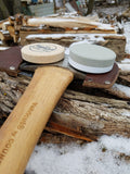 Medium grit, American made Whiskey River American Pioneer Pocket sharpening stone. Use this stone wet or dry. Easily restores the edge of your axe in no time! pictured with the council tool saddle axe and the whiskey river arctic fox dual grit sharpening stone