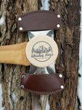 Medium grit, American made Whiskey River American Pioneer Pocket sharpening stone. Use this stone wet or dry. Easily restores the edge of your axe in no time! Pictured with the council tool saddle axe