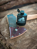 axe oil from walrus oil - a great way to protect your handle and head of your axe. this picture is showing the flip cap of the walrus oil axe oil bottle