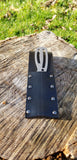 view of the grimalkin bushcraft and survival knife in it's provided utility sheath