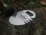 The whiskey river bottle opener and bevel gauge. Open your favorite beverage and measure the exact angle of the bevel of your axe head with this clean and machined tool. Seen next to the council tool pack axe in this photo